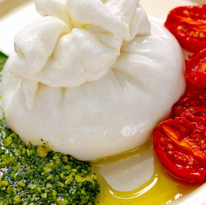 BURRATA WITH PESTO, ROASTED TOMATOES + DENISSIMO