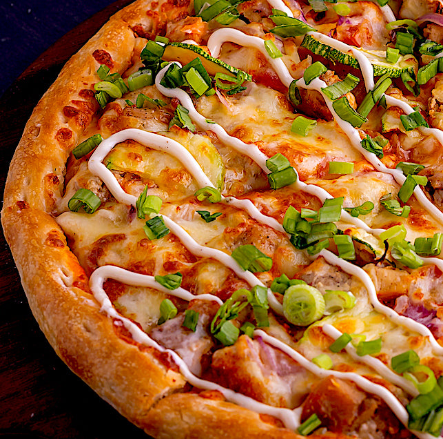 BUFFALO CHICKEN PIZZA WITH CHIPOTLE & LIME CREMA
